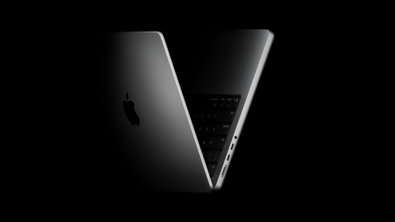 Ilustracija Apple M6 procesora postavljenog na matičnu ploču laptopa MacBook Pro koja prikazuje naprednu 2nm arhitekturu i WMCM module.